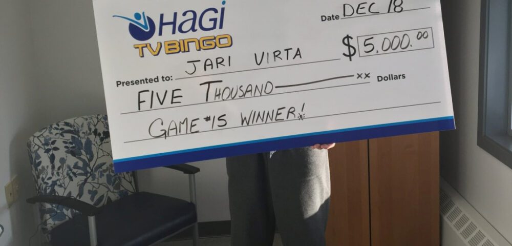 Person holding a cheque