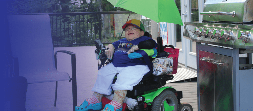 Person in wheelchair in front of Barbecue