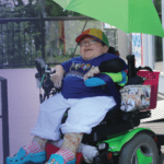 Person in wheelchair in front of Barbecue