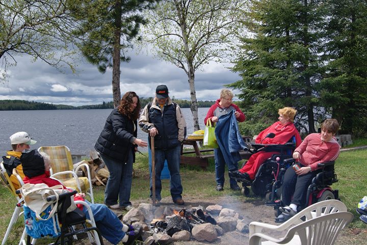 People camping around a fire